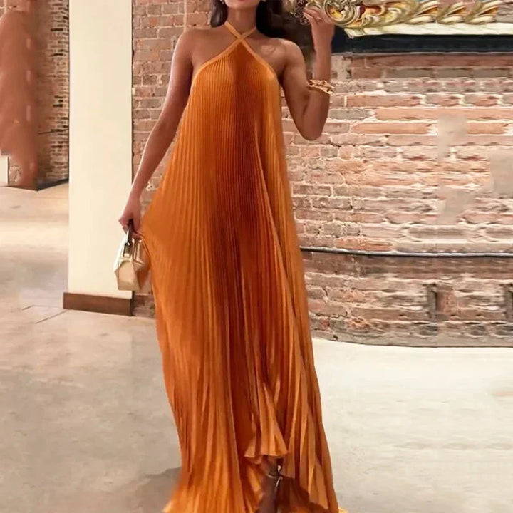 Women's vibrant orange pleated maxi dress with a stylish halter neck, ideal for special occasion formal wear.