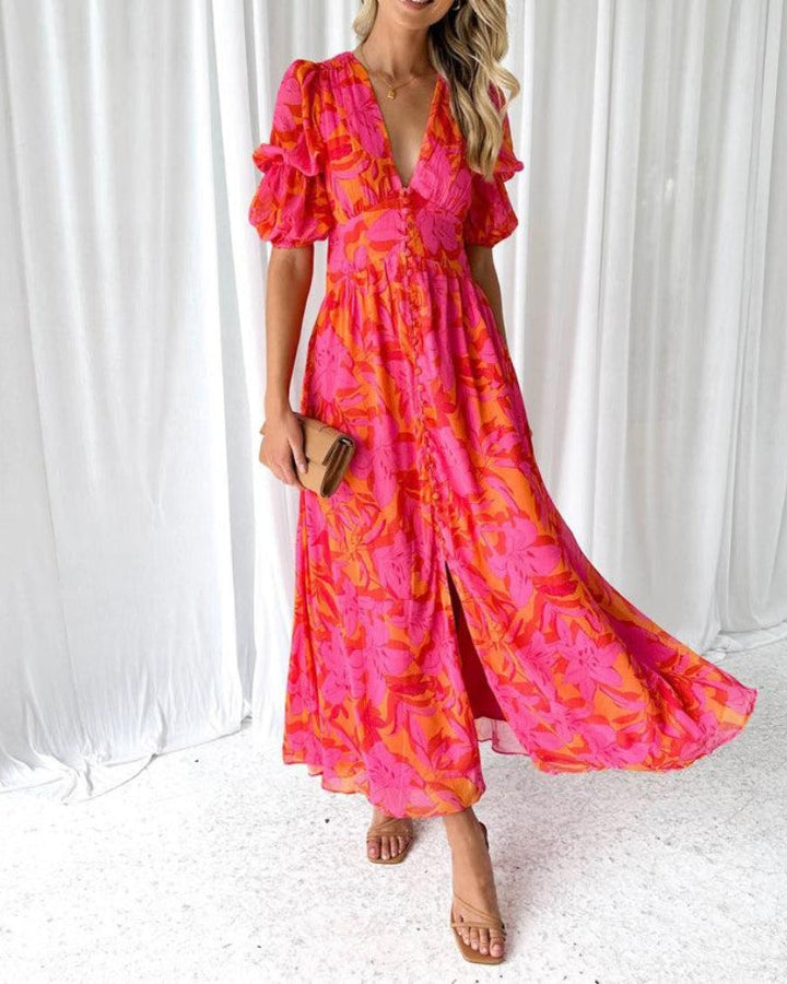 Elegant orange women's flowing maxi dress with stylish puff sleeves and a flattering V-neck, perfect for summer occasions.