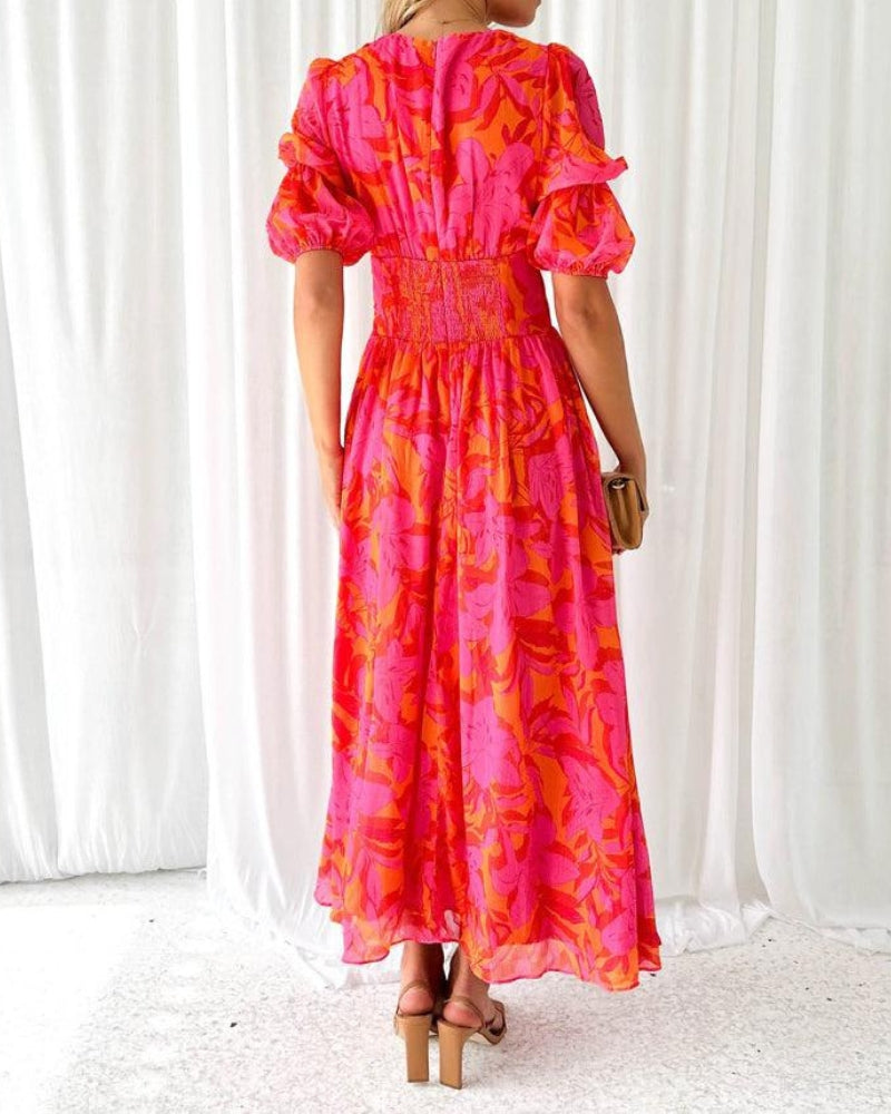 Comfortable orange flowing maxi dress for women with elegant puff sleeves and a flattering V-neck, great for any occasion.