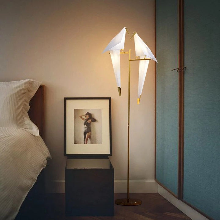 Modern origami bird table lamp, a wireless and magnetic accent light enhancing home decor.