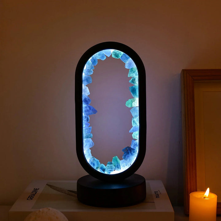 Elegant oval glass desk lamp with modern design, perfect for office or home decor.