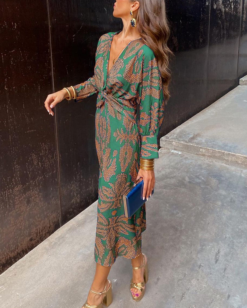Women's flowing A-line maxi dress with knot front detail, an elegant V-neck design for wedding guests.