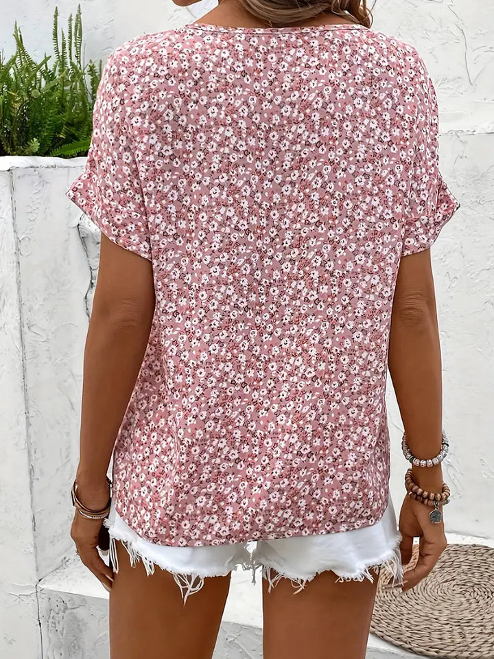Women's chic short sleeve floral button-down blouse in pink, ideal for feminine everyday wear.