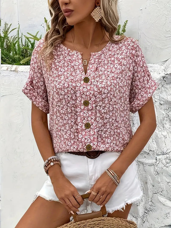 Elegant pink floral button-down women's top, short sleeve, perfect for a stylish summer or everyday look.