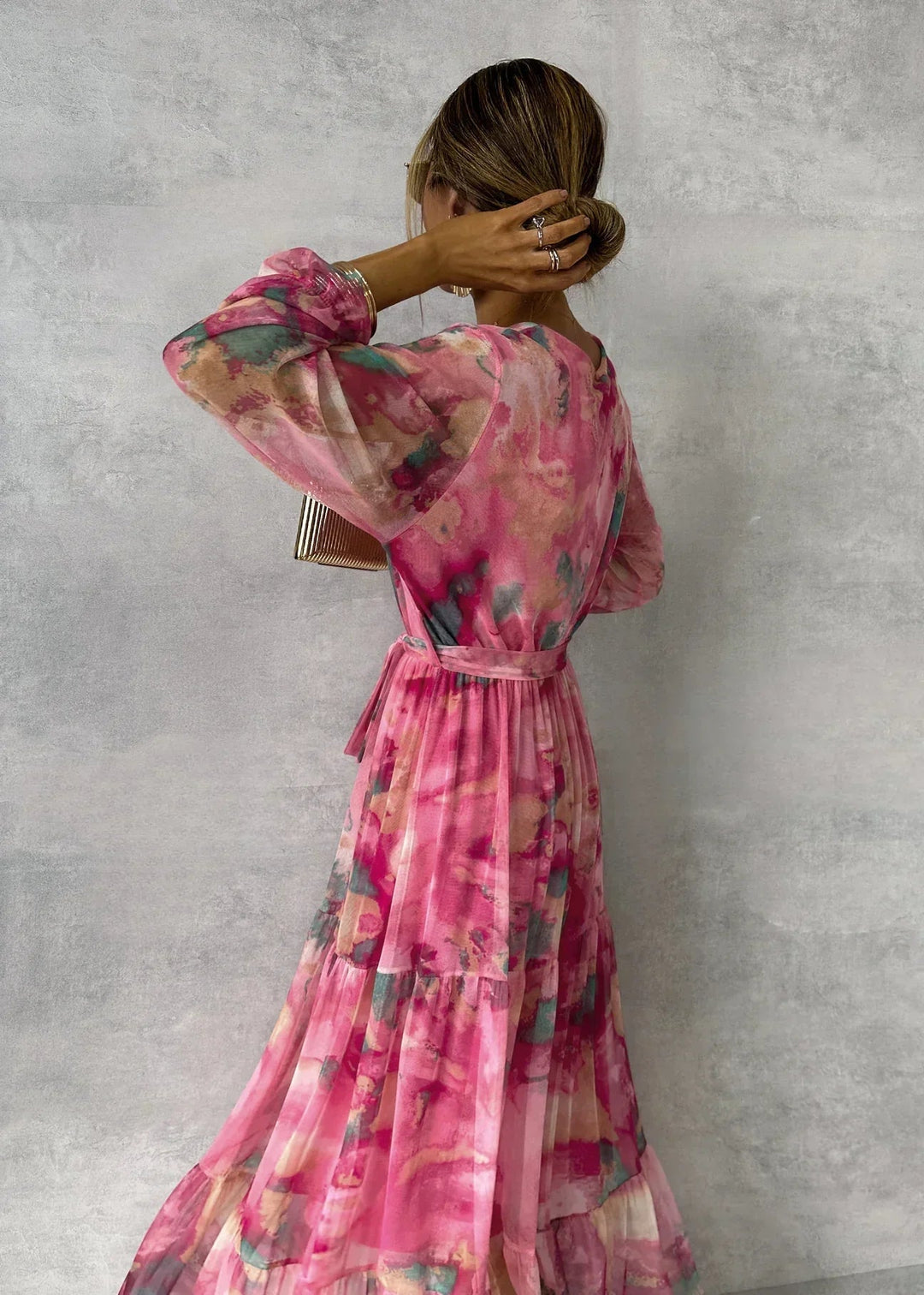 Stylish pink floral wrap maxi dress for women, a beautiful long sleeve V-neck design for summer occasions.