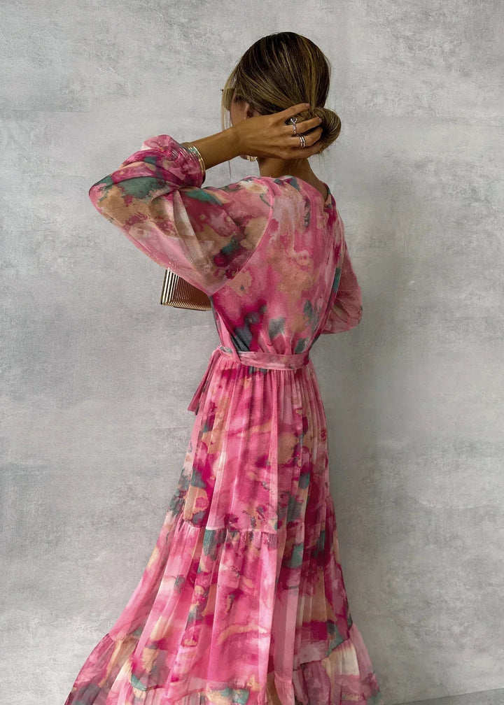 Stylish pink floral wrap maxi dress for women, a beautiful long sleeve V-neck design for summer occasions.