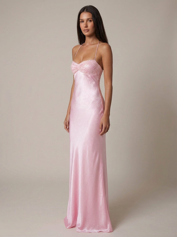 Women's elegant halter maxi dress in pink, ideal for special occasions, features a stylish lace-up back.