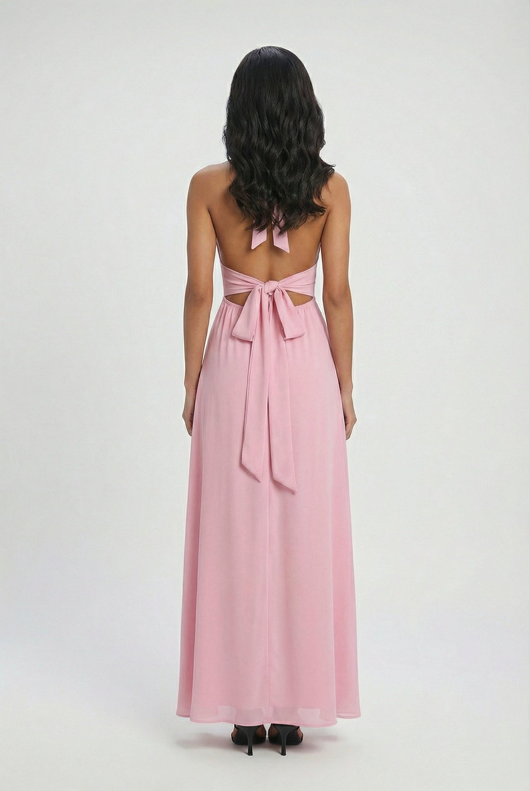 Stylish pink halter neck maxi dress, a versatile choice for parties and summer occasions.