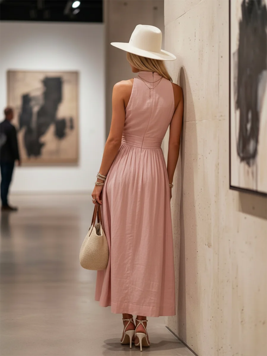 Lightweight sleeveless pink halter V-neck maxi dress, elegant comfort and flowing design for summer.