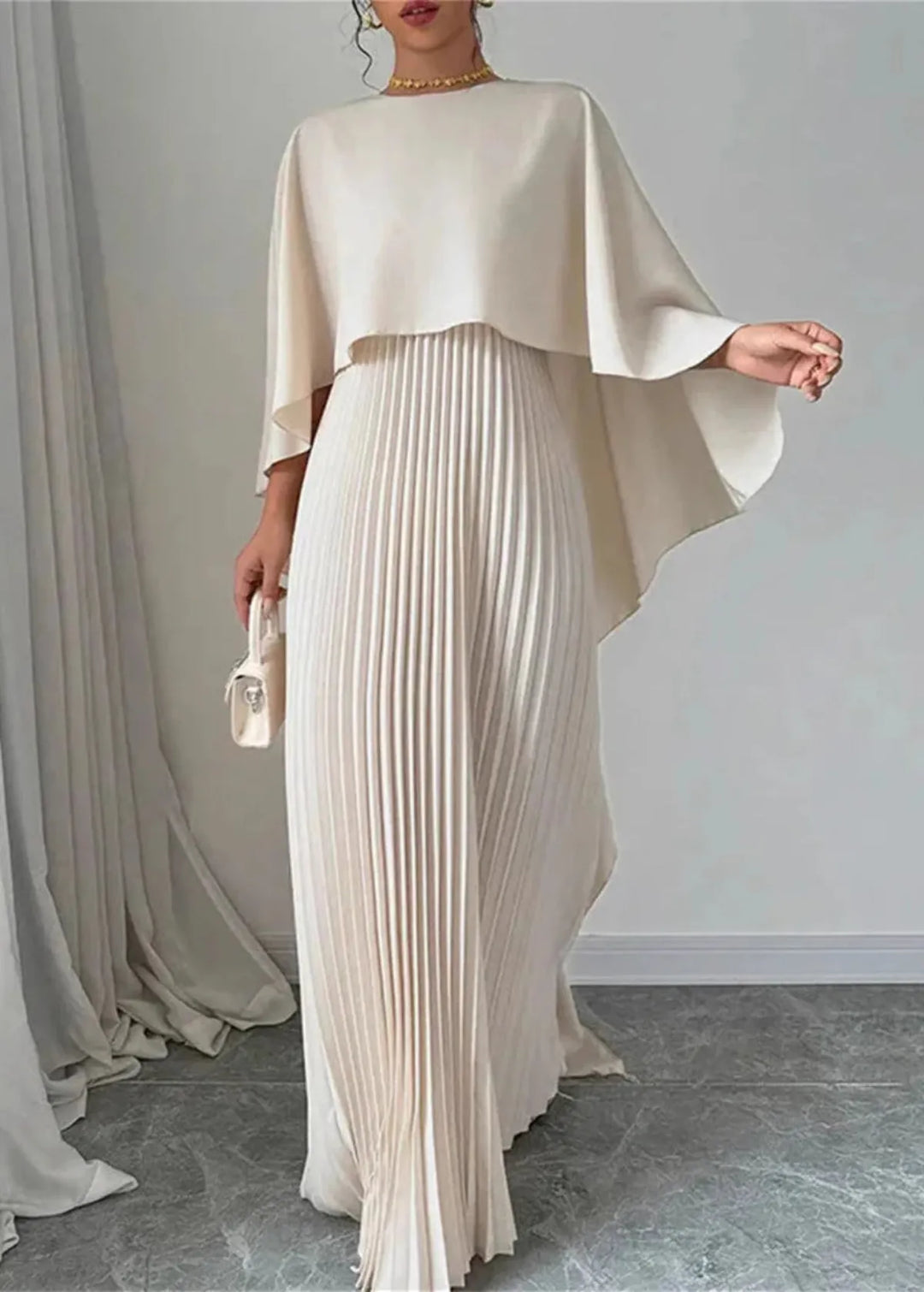 Elegant pleated cape maxi dress for women, ideal wedding guest attire or formal special occasion evening gown.