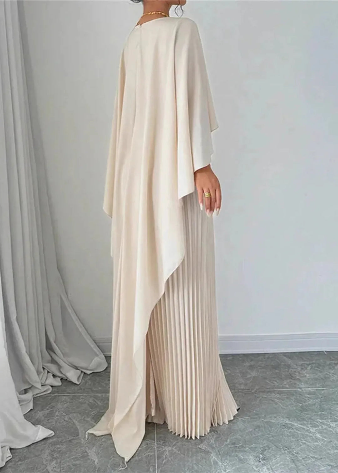 Women's formal pleated maxi dress with a sophisticated cape detail, perfect for wedding guests & evening events.