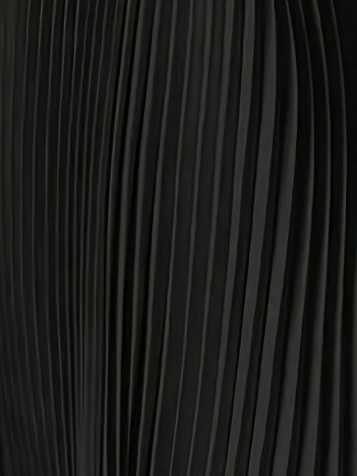 Model showcasing a chic women's pleated cape maxi dress, ideal for wedding guests & formal evening wear.