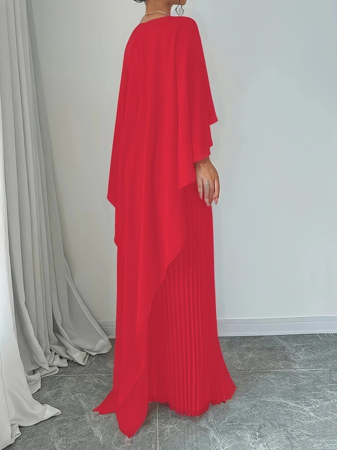 Luxurious pleated cape maxi dress, an elegant women's formal gown for weddings & special events.