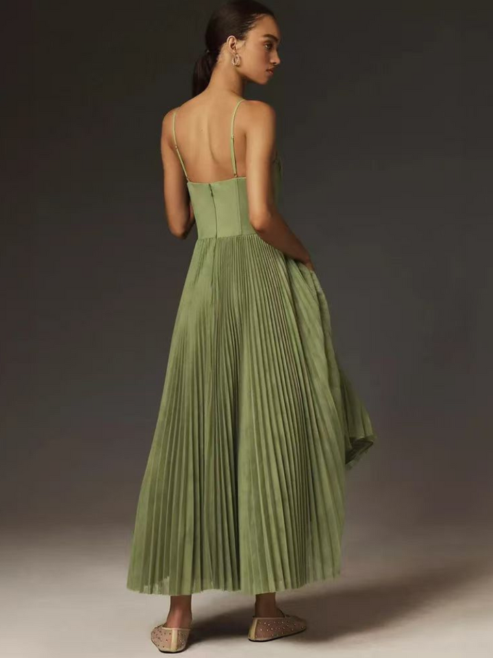 Women's formal evening gown, an elegant pleated maxi dress with a flowing silhouette.