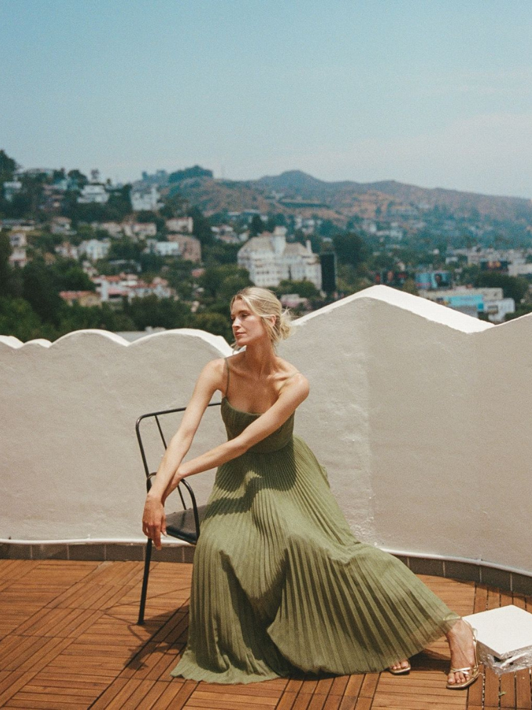 Women's elegant pleated maxi dress, a chic & flowing option for sophisticated occasions.
