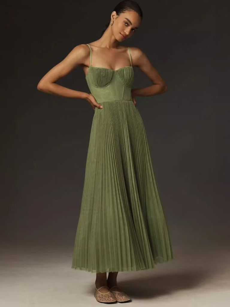 Elegant pleated maxi dress, a perfect wedding guest outfit with a flowing sophisticated design.