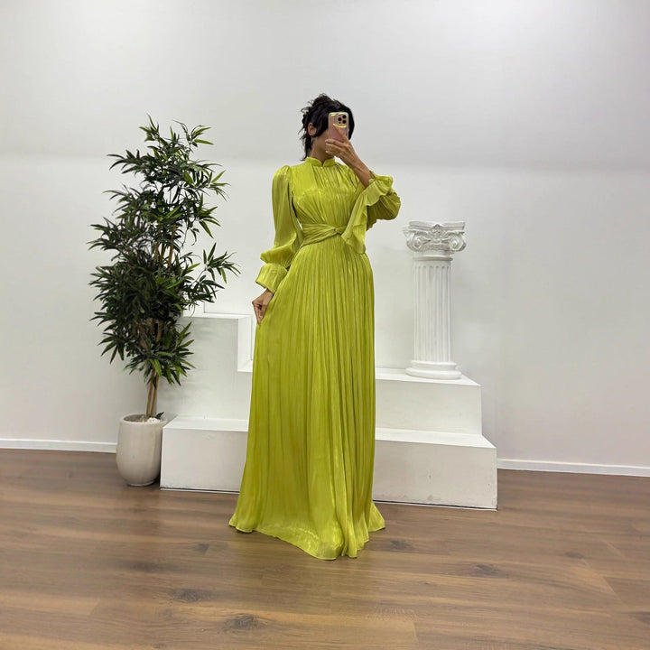 Elegant pleated maxi dress for women with long blouson sleeves, perfect for formal occasions.