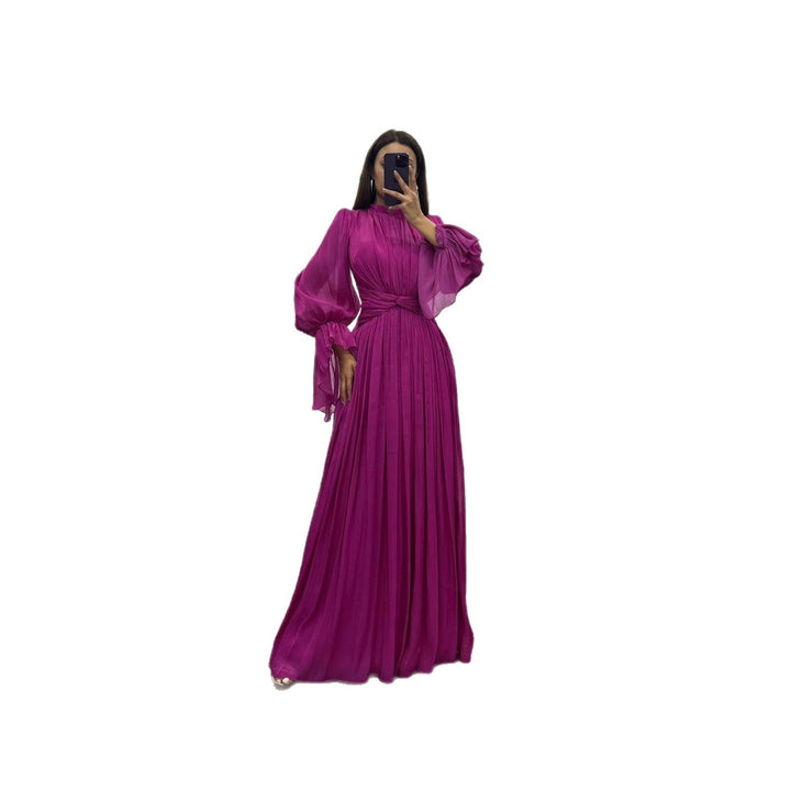 Flowy elegant pleated maxi dress for women, featuring long sleeves and a sophisticated silhouette.