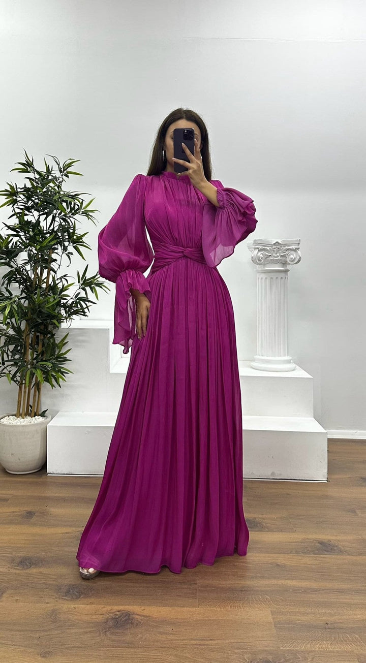 Sophisticated women's pleated maxi dress with elegant long sleeves, suitable for formal and party wear.