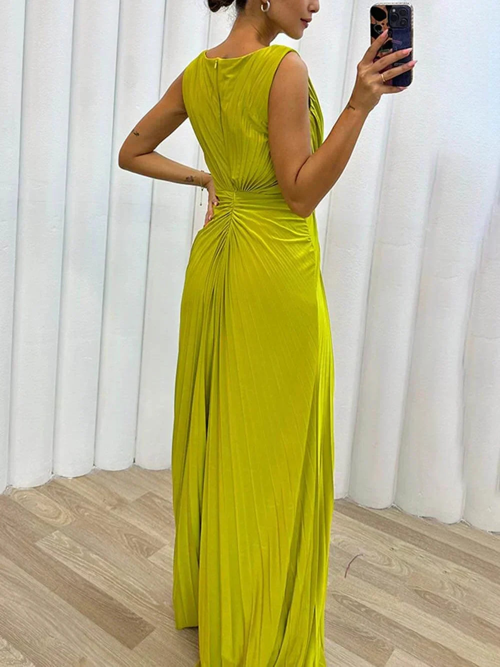 Sophisticated women's pleated sleeveless maxi gown, elegant choice for weddings and formal parties.