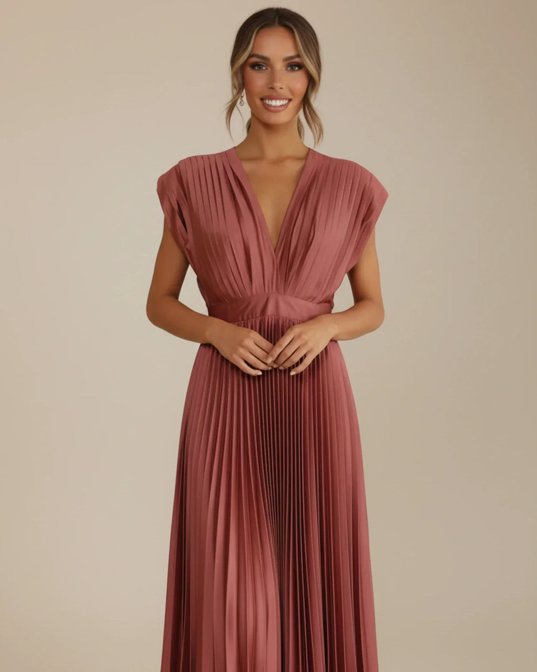 Chic sleeveless pleated midi dress, V-neck, fit & flare style. An elegant choice for any special occasion.
