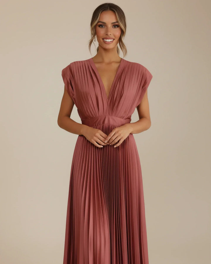 Chic sleeveless pleated midi dress, V-neck, fit & flare style. An elegant choice for any special occasion.