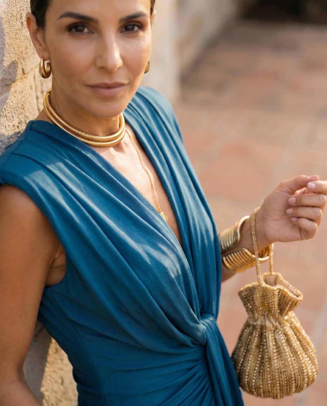 Blue women's elegant draped evening dress, perfect for sophisticated special occasions.