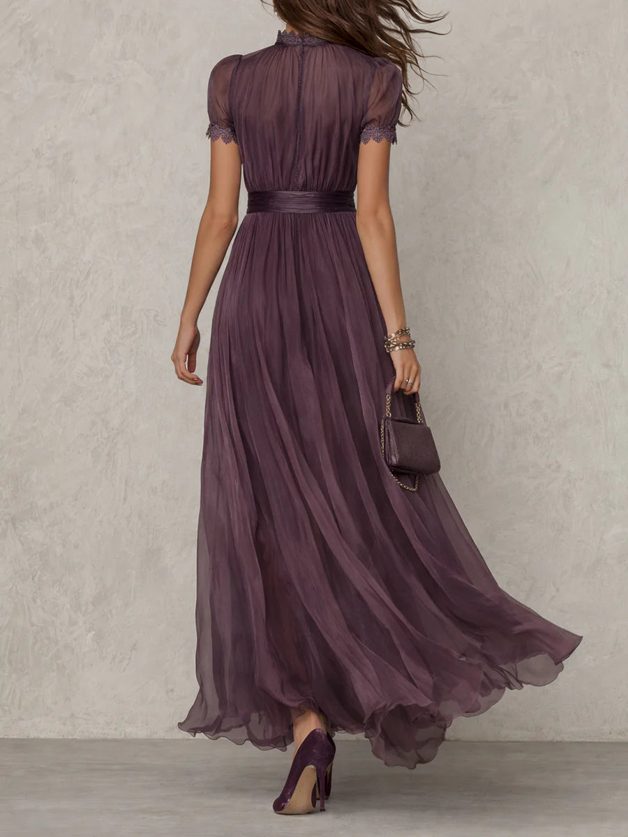 Flowy elegant purple long dress with a sophisticated drop neck, excellent for formal occasion wear.