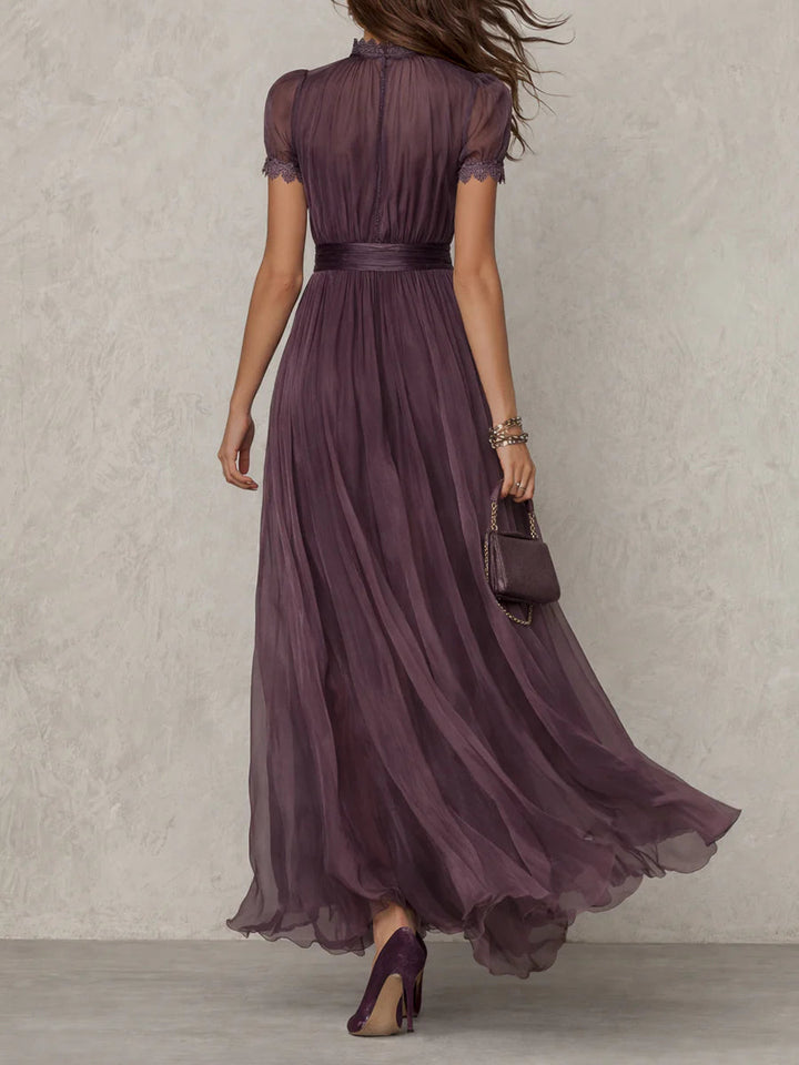 Flowy elegant purple long dress with a sophisticated drop neck, excellent for formal occasion wear.