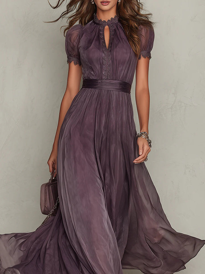 Women's elegant flowy purple long dress featuring a stylish drop-neck design for formal evening wear.