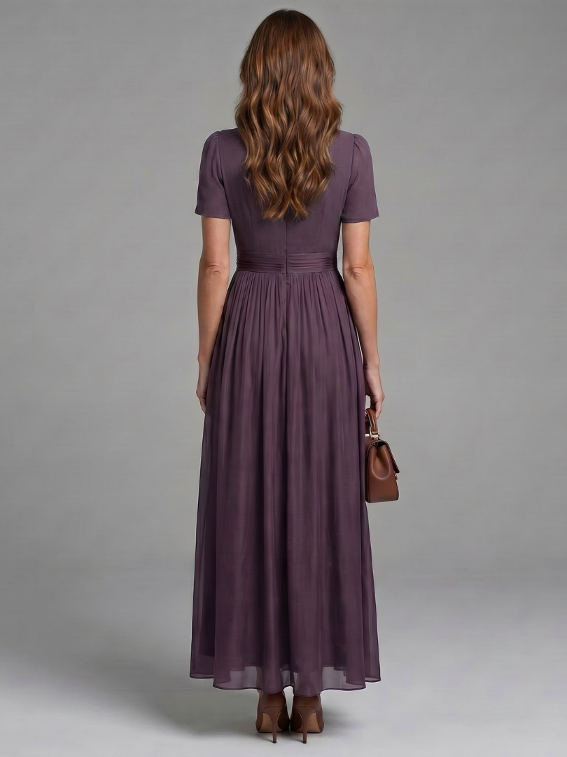 Chic women's short-sleeve purple maxi dress. Features keyhole neckline, gathered waist. Ideal comfortable summer daywear.