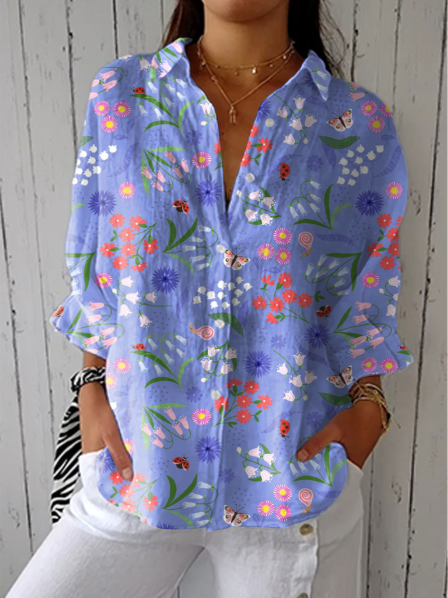 Elegant purple women's blouse with floral print, button-down front, and relaxed fit for versatile spring-summer style.