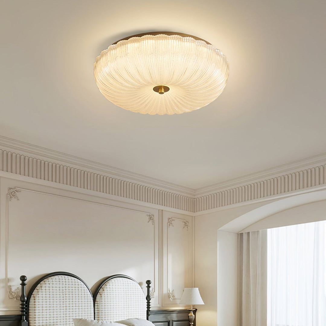 LED flush mount ceiling light, round with rippled glass, offering adjustable illumination.