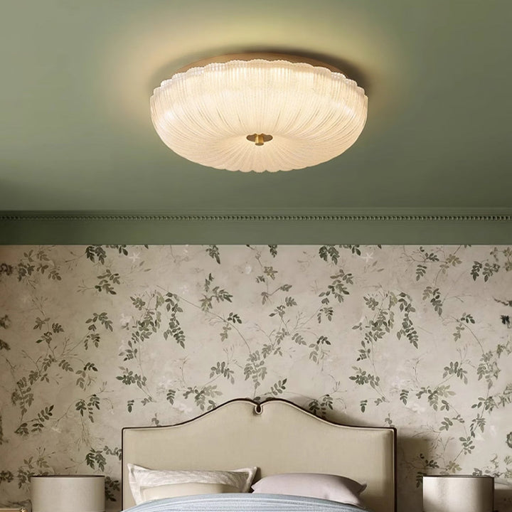 Adjustable LED round flush mount ceiling light, rippled glass, brightens any modern indoor space.