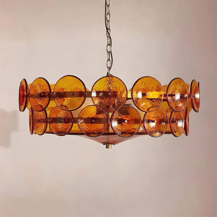 Architectural round glass & metal chandelier, enhancing modern interior design.