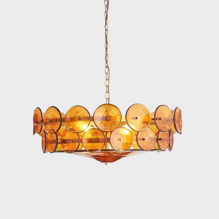 Elegant round glass pendant light illuminating a luxurious foyer.