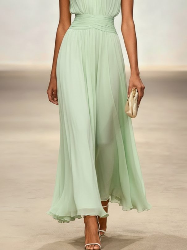 Elegant sleeveless wedding guest dress, ruched A-line maxi style.