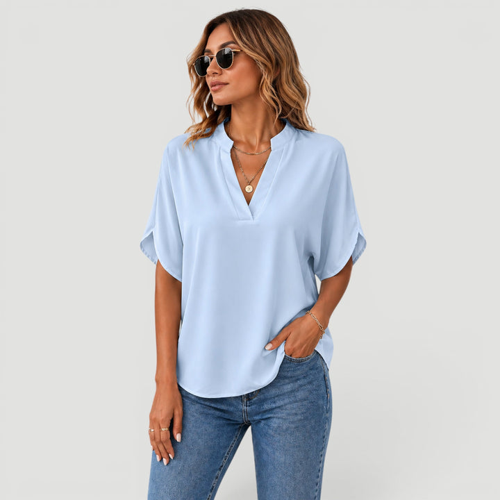 Elegant short sleeve blouse for women, perfect for office or casual chic everyday wear.