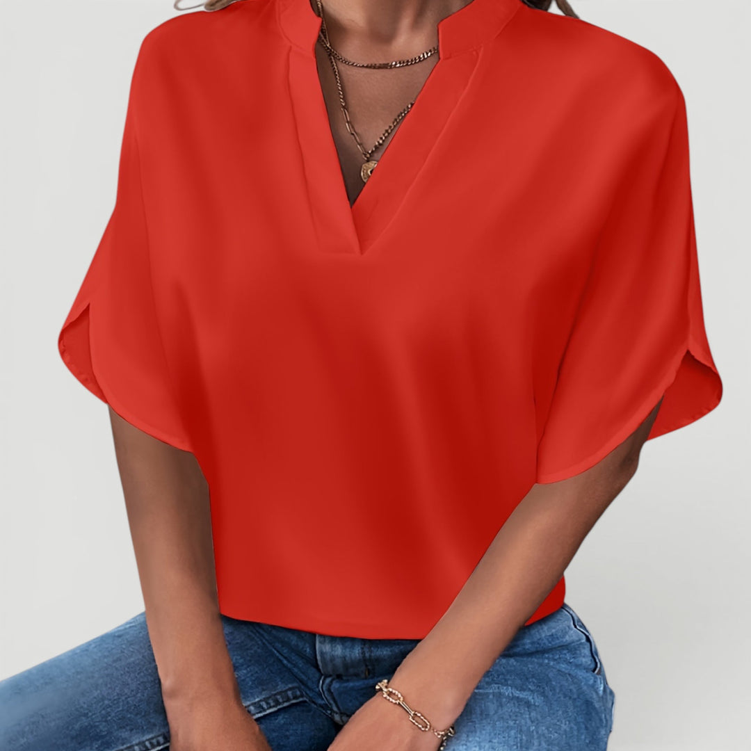 Lightweight elegant short sleeve blouse, ideal for ladies' casual or professional outfits.
