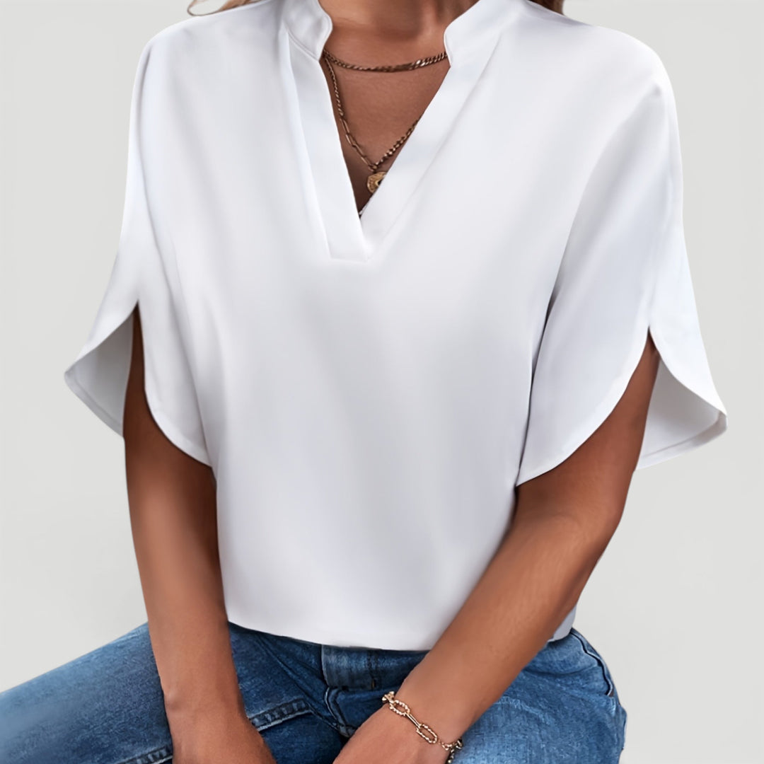 Stylish modern short sleeve blouse for women, great for elegant casual chic looks.