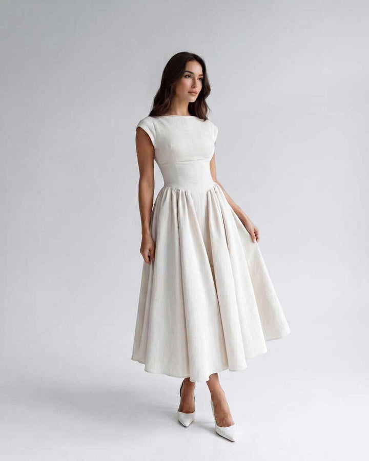 Elegant women's sleeveless A-line midi dress, flowing fabric, perfect for formal events & evening.