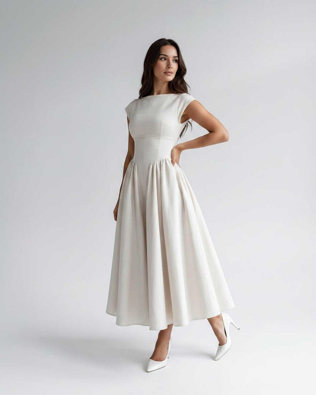 Formal women's sleeveless A-line midi dress, elegant design with a flattering gathered waist.