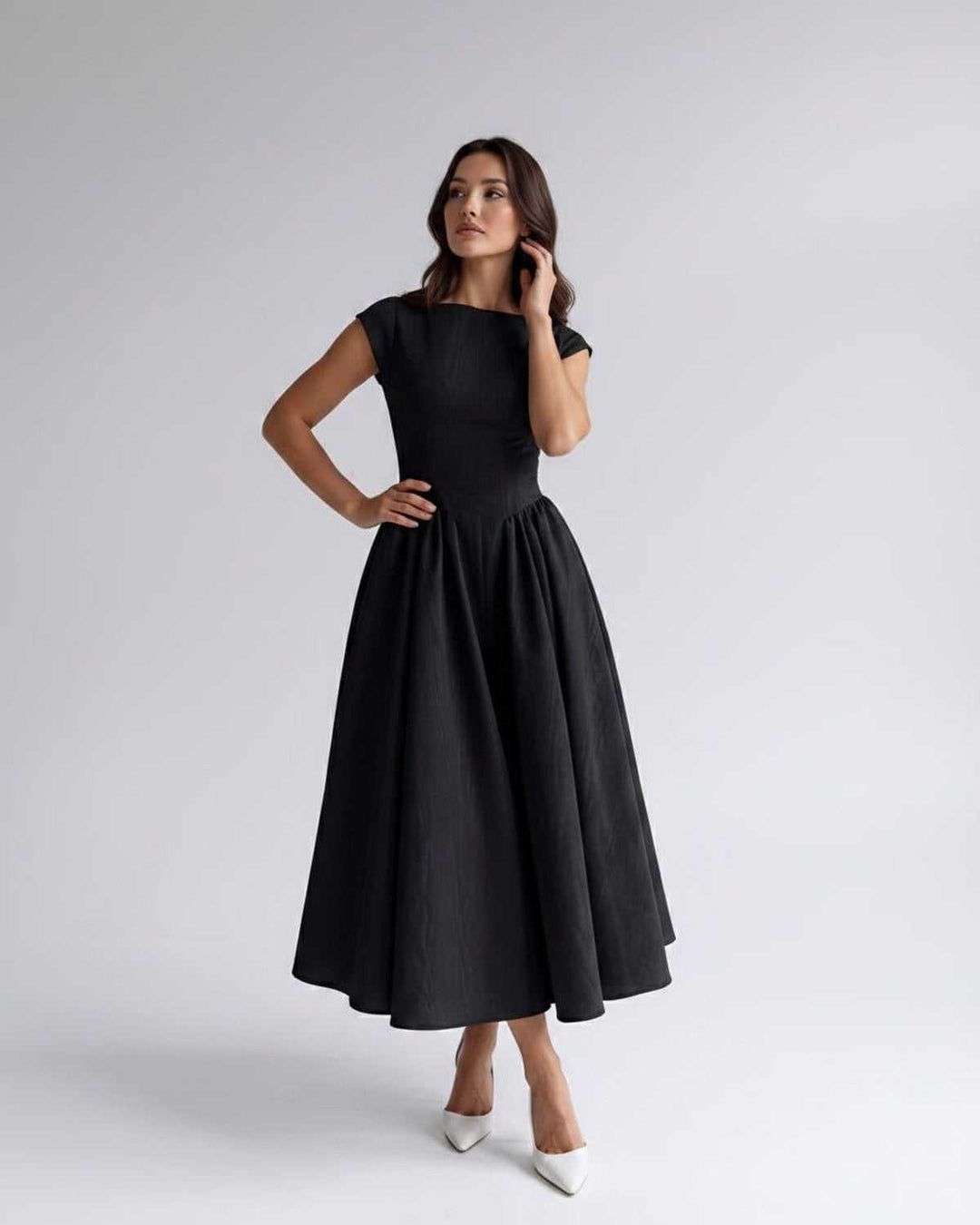 Chic sleeveless A-line midi dress for women, an elegant choice for parties and formal gatherings.