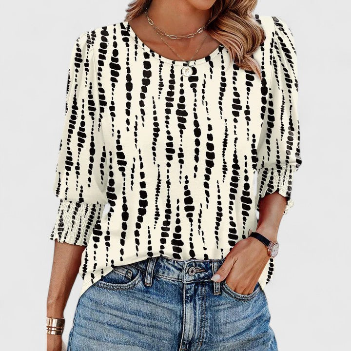 Casual chic smocked long sleeve top for women. Effortless style, relaxed fit, perfect for summer.