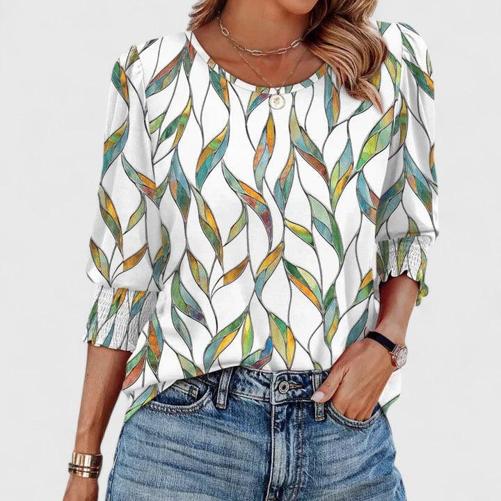 Versatile smocked women's top. Elegant long sleeve, relaxed fit, ideal for casual and layering.