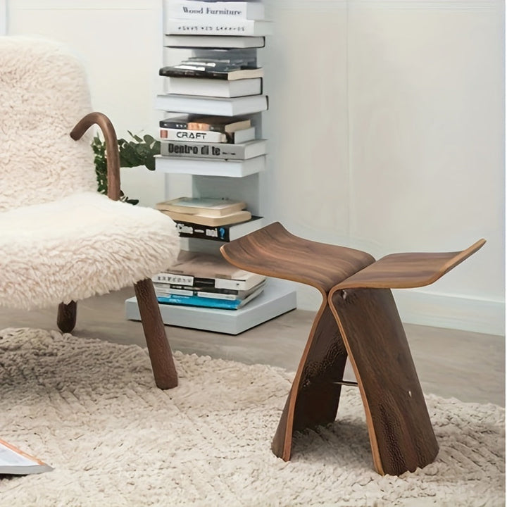 Elegant butterfly stool with timeless design, ideal for modern living spaces.