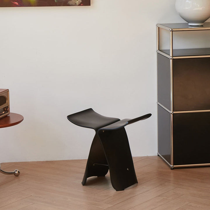 Functional butterfly stool, serves as entryway bench or decorative accent.