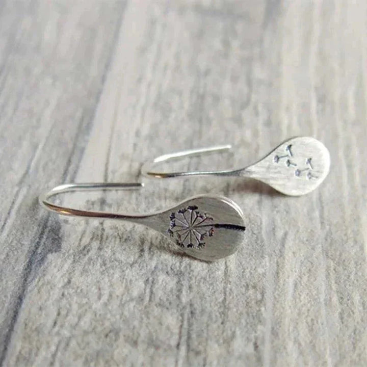 Delicate sterling silver dandelion teardrop dangle earrings for women, elegant and unique nature-themed silver jewelry.