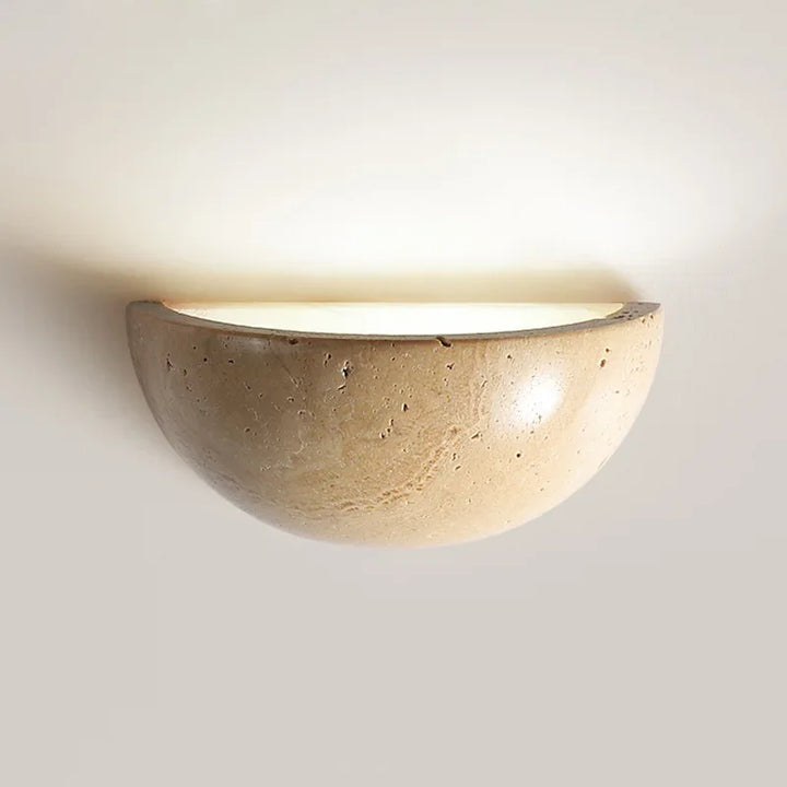 Elegant stone LED wall light for modern home ambiance. Energy-efficient wall sconce.