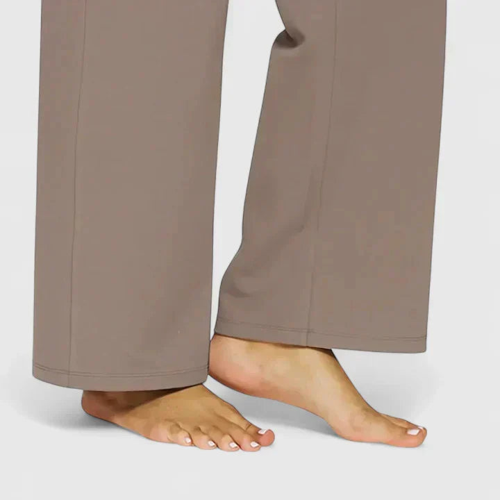Comfortable straight leg women's trousers, perfect for long hours, shown on a sitting model.